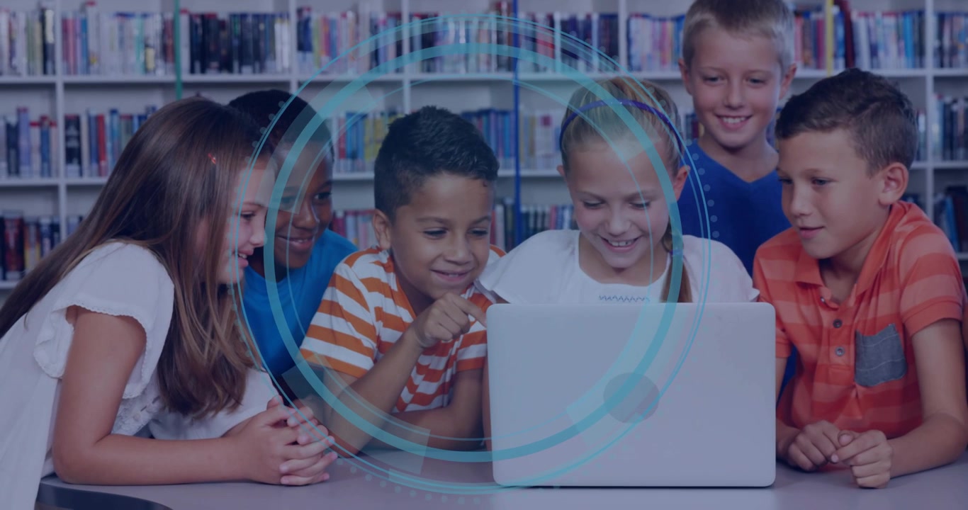 Six students leaning around laptop in library tapping screen and exploring cyber security HUD rings