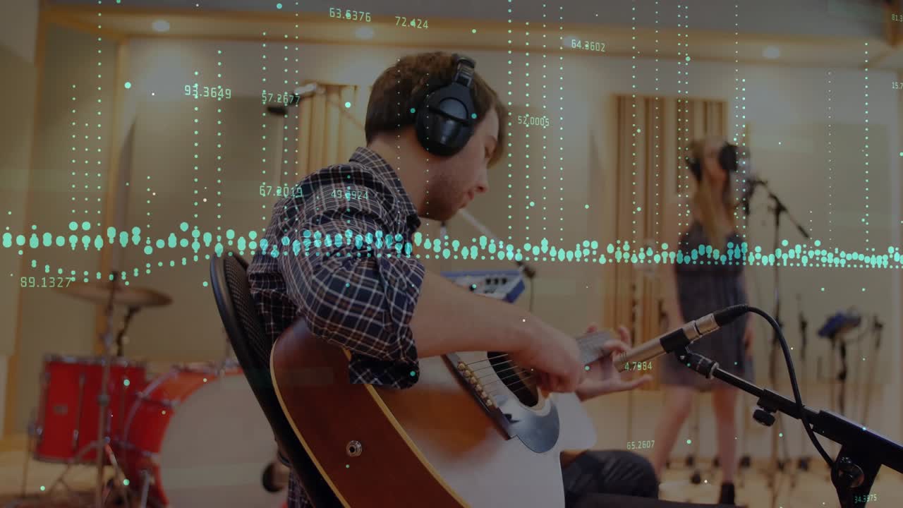 Guitarist tuning guitar, starting recording, vocalist adjusting mic while waveform tracking audio