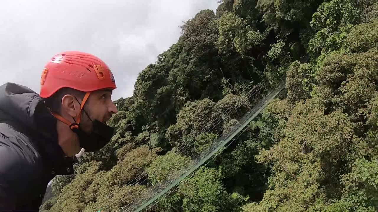 Man flying over the Costa Rican cloud forest, canopies, extreme adventure