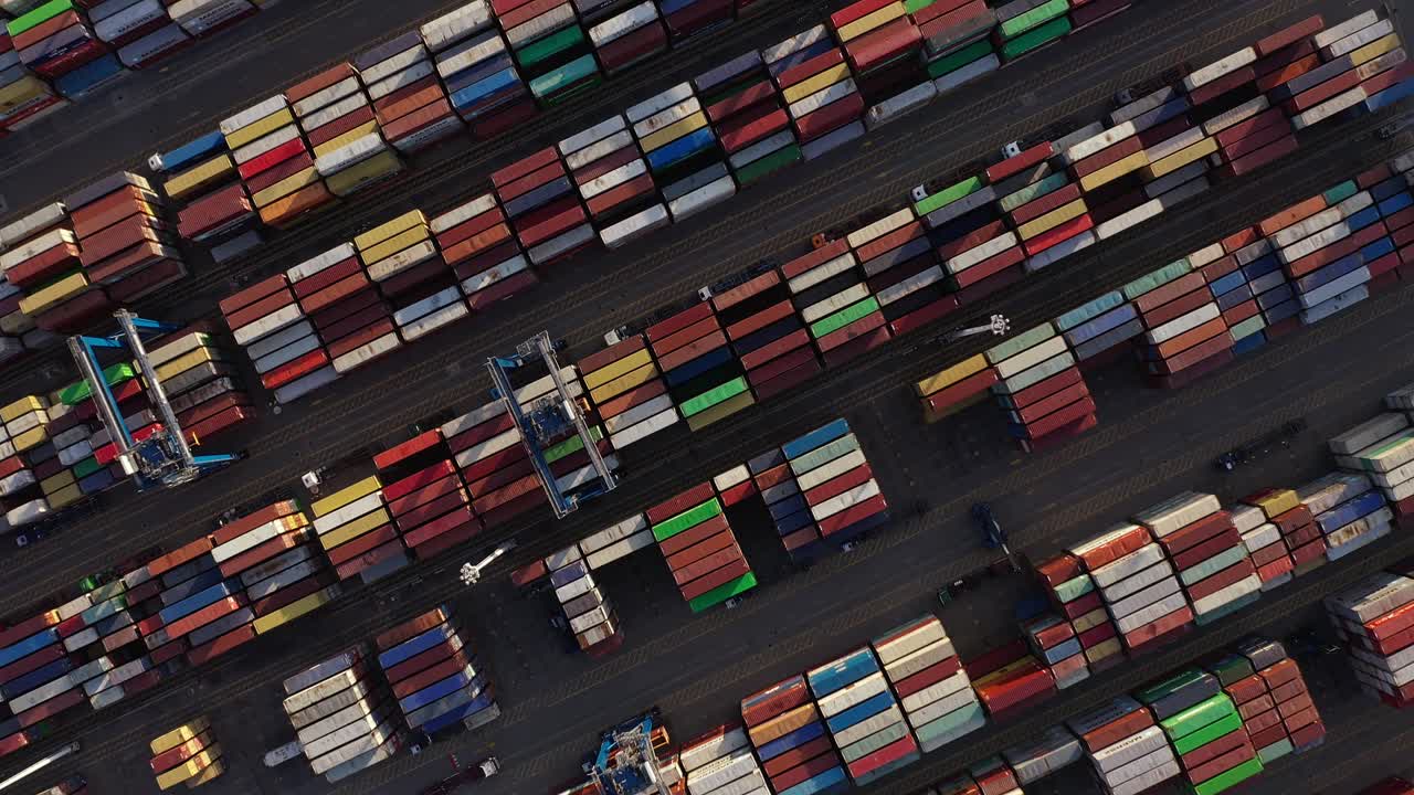 Container Port - Stacked Of Industrial Intermodal Containers With Gantry Cranes