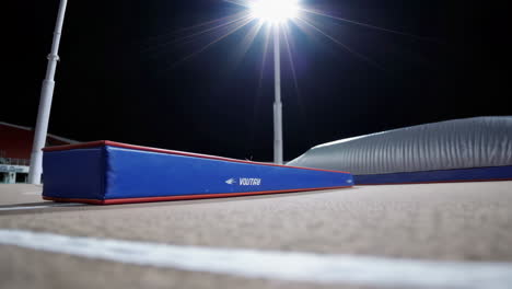 long jump run-up and landing pit at night