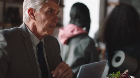 businessmen-shaking-hands-in-coffee-shop-enjoying-successful-business-deal-partnership