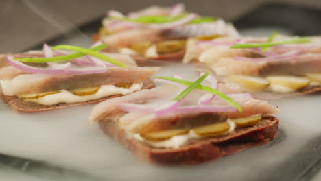 smoked fish sandwiches with dill, onions and cream cheese