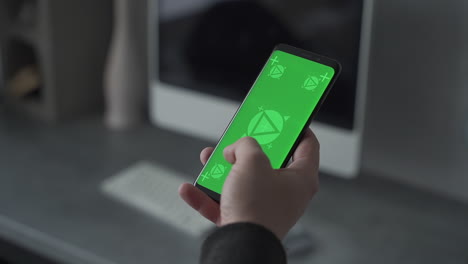 smartphone with green screen chroma. swiping and scrolling. mockup. close-up.