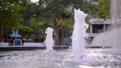 shot of a water fountain in an some what empty square in the woodlands, texas