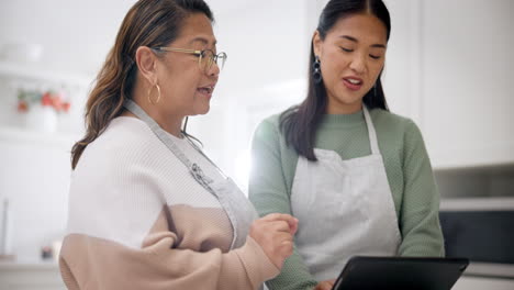 Tablet,-cooking-and-search-with-senior-mother