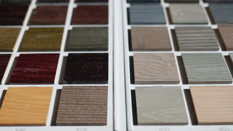 slider shot: palette with painted wood samples to select the color of wood products.