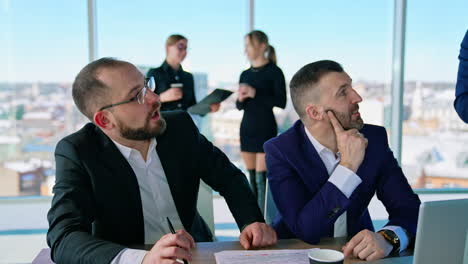 businesspeople interacting at meeting in conference room at office