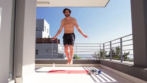 caucasian man doing sport at home during coronavirus covid19 pandemic
