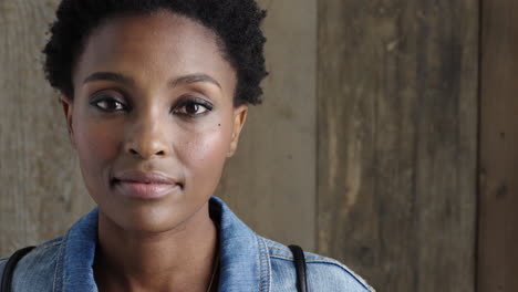 portrait-of-independent-young-african-american-woman-looking-serious-at-camera-wearing-stylish-denim-jacket-copy-space