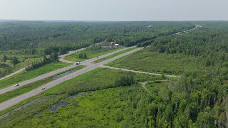 aerial above highway 11 in muskoka with forest and countryside