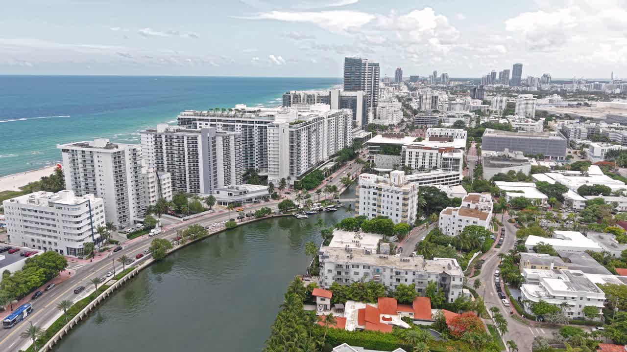 Drone Shot of Miami Beach and Indian Creek, Florida USA, Waterfront Buildings and Traffic