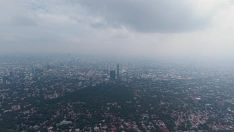drone footage of a cloudy morning with low clouds above south mexico city