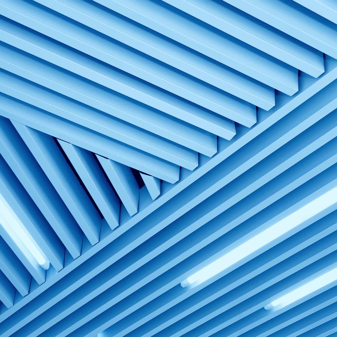 Bright white light illumination on the embossed ceiling. Long led lamps working. Low angle perspective