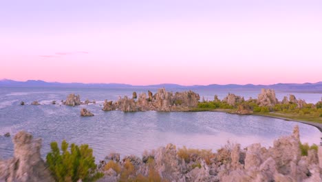 4k aerial of tufa rocks in mono lake, at sunset