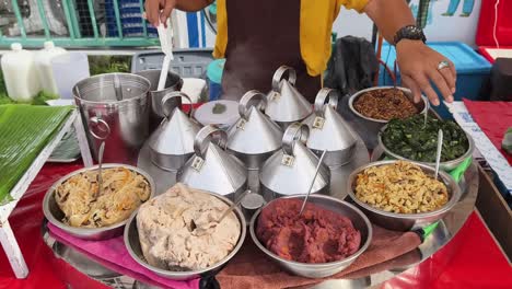 street food vendor with steamed buns and toppings