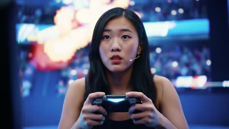 intense focus and competitive spirit: a gamers journey through the arena as she prepares for battle against challengers in an e-sports tournament
