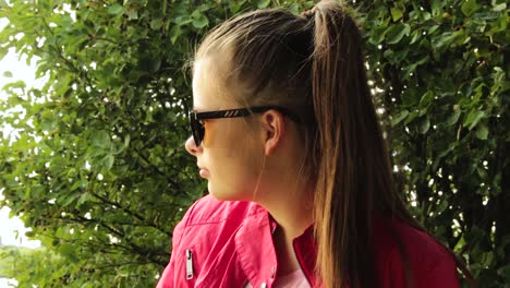 girl sitting outside, looking out