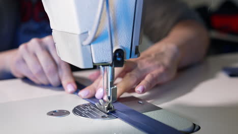 female hands working on tailoring