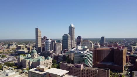 aerial orbiting shot of the large skyscrapers in downtown indianapolis