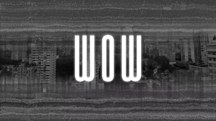Animation of wow text in white over distorting film of cityscape