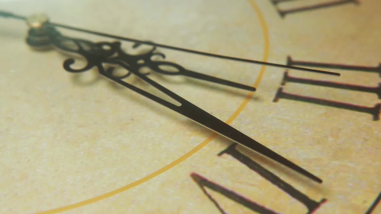 White clock face with three long black arrows pointing eighteen minutes past three