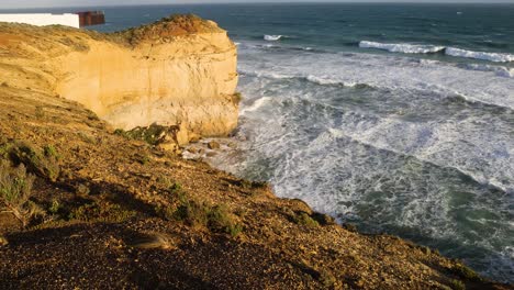 ocean waves hitting the twelve apostles cliffs