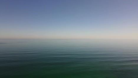 drone shot flying high over the big open ocean with nothing in sight