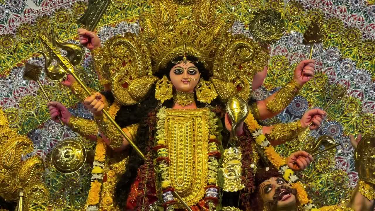 Close-up shot of heavenly Goddess Durga Maa in yellow attire