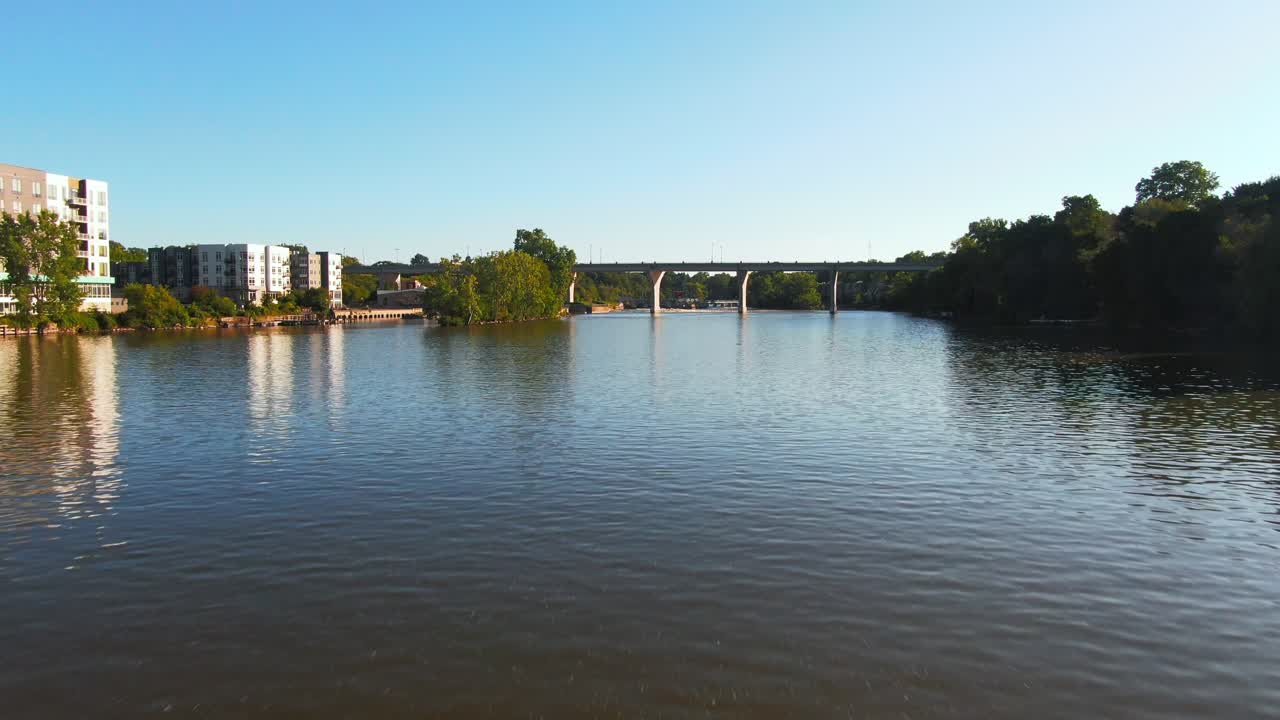 Drone Shot Passing Under Fox River Bridge to Reveal Rapids and Dam