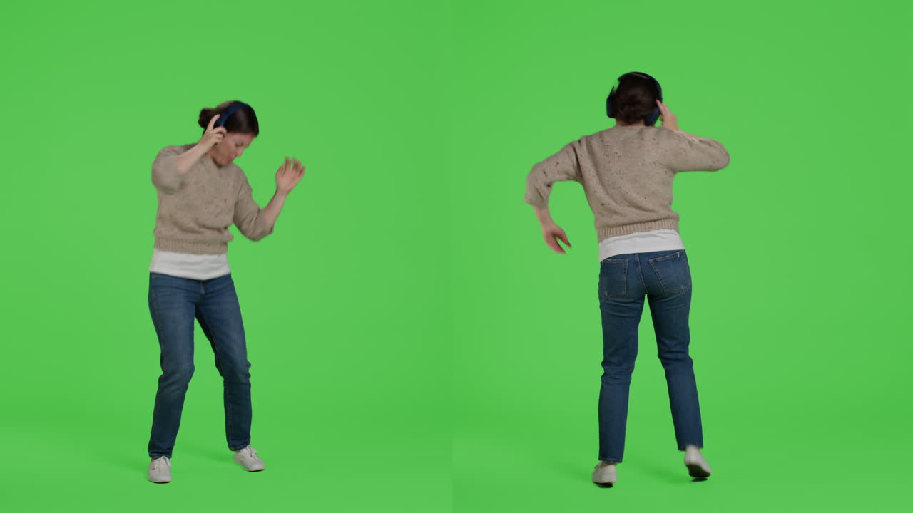 Woman dancing with headphones on a green screen
