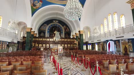 step into a breathtaking church where golden chandeliers hang from a high ceiling, and vibrant frescoes tell sacred stories. the tranquil setting invites reflection and admiration