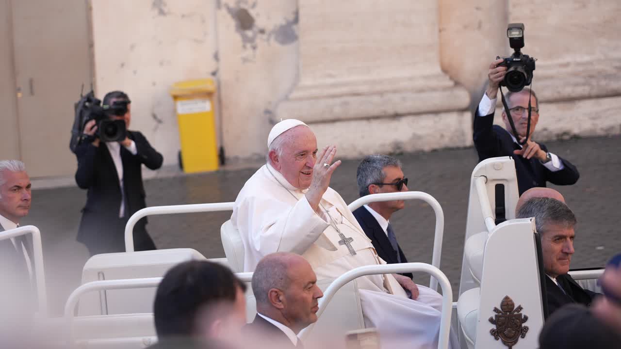 People greeting the pope Francisco in his popemobile car in Vatican city cinematic slow motion close up shot. St. Peter's Square (Piazza San Pietro).