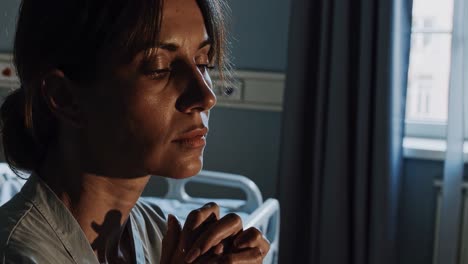 female patient experiencing profound moments of spiritual connection, seeking inner peace and strength while navigating medical challenges within hospital room's quiet environment