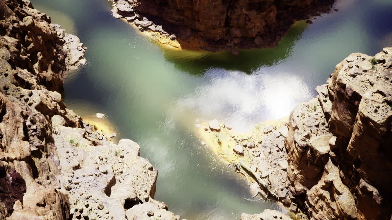 Scenic view of a winding river through rocky canyons in bright sunlight