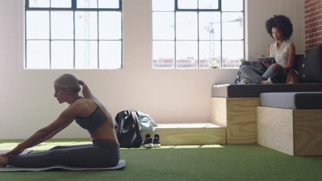 young business woman doing yoga stretching enjoying meditation on lunch break in modern office workplace