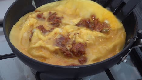 Longaniza-with-scrambled-eggs-mixed-on-a-pan