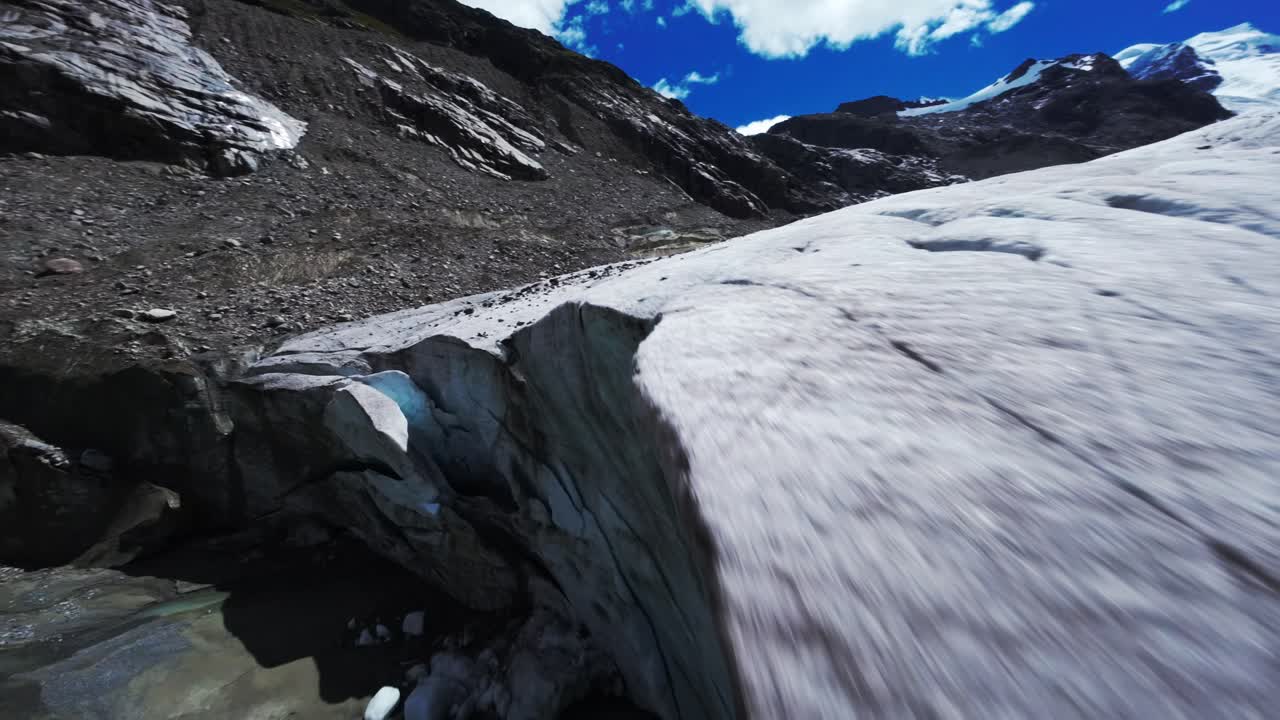 FPV drone over Swiss glacier capturing majestic icy landscape