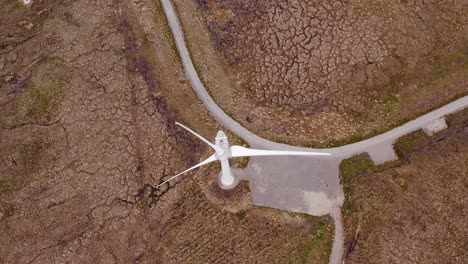 drone fly-over of a moorland wind turbine on the isle of lewis, hebrides