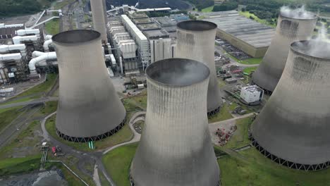 ratcliffe-on-soar power station aerial view dolly across smoking coal powered nuclear fired cooling towers