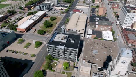 Downtown-Davenport,-Iowa-with-drone-video-moving-right-to-left-from-the-clock-tower-to-the-Mississippi-River