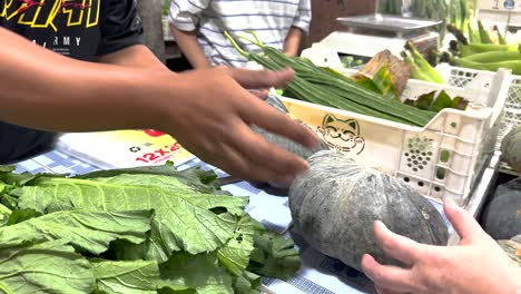 fresh pumpkins and vegetables at asian market