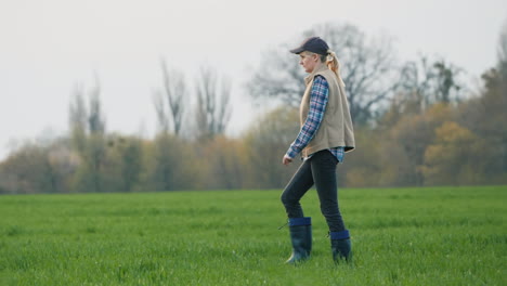 A-Woman-Farmer-Goes-To-Her-Field-Where-Winter-Wheat-Has-Sprouted