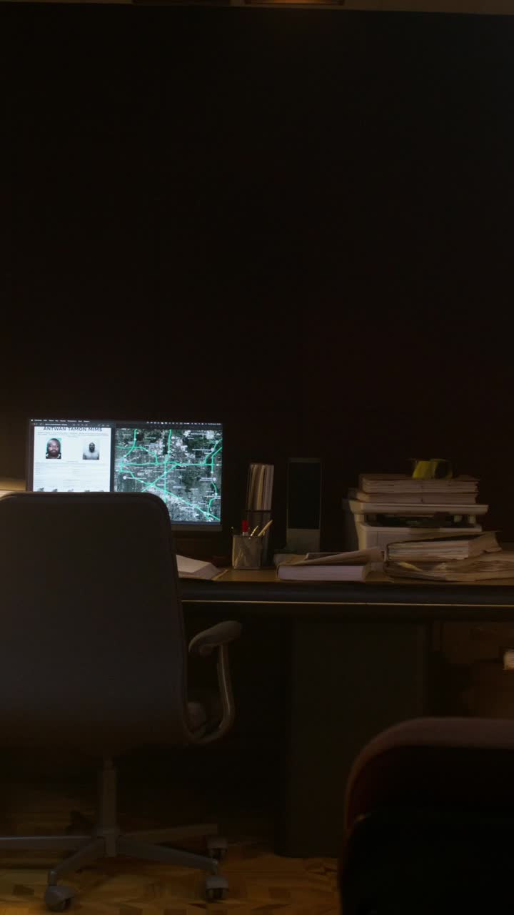 Dark Office Workspace with Computer and Documents