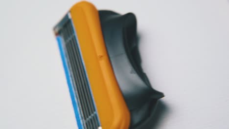 motion over cassettes for shaving razor on white surface