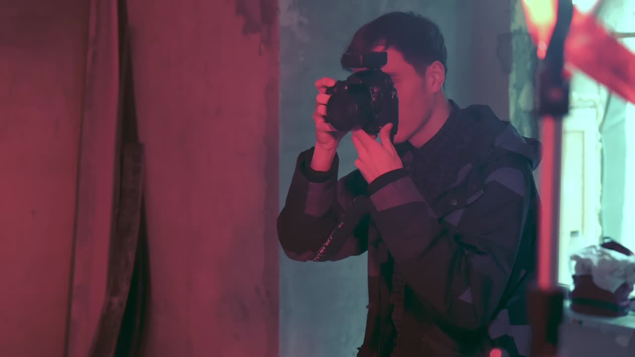 Photographer taking photo of a model with a virtual reality head set