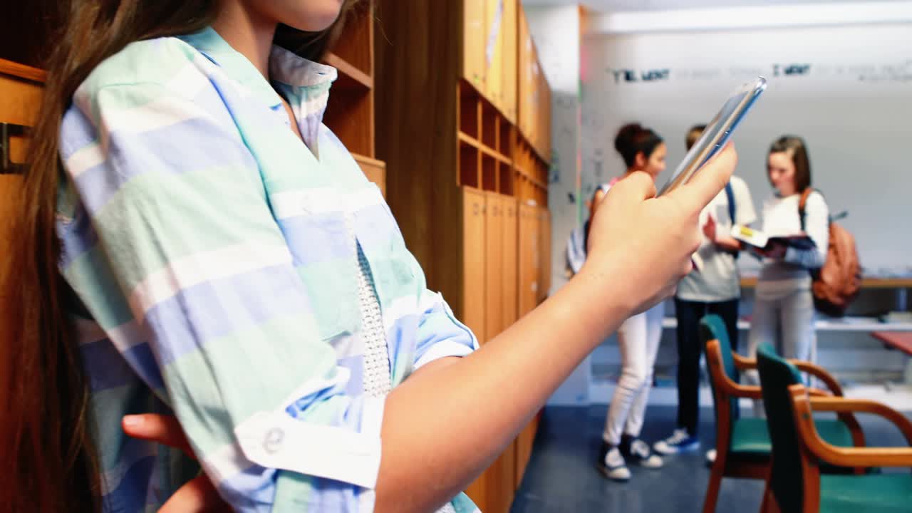 Left teen student tapping phone by lockers, causing social badges filling study area for education