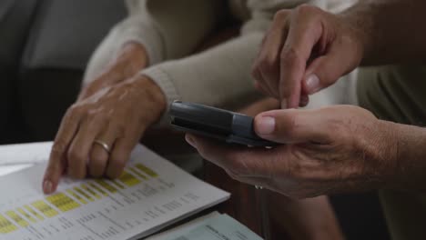 Senior-man-and-woman-checking-documents