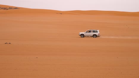 slow shots of a 4x4 in the algerian desert