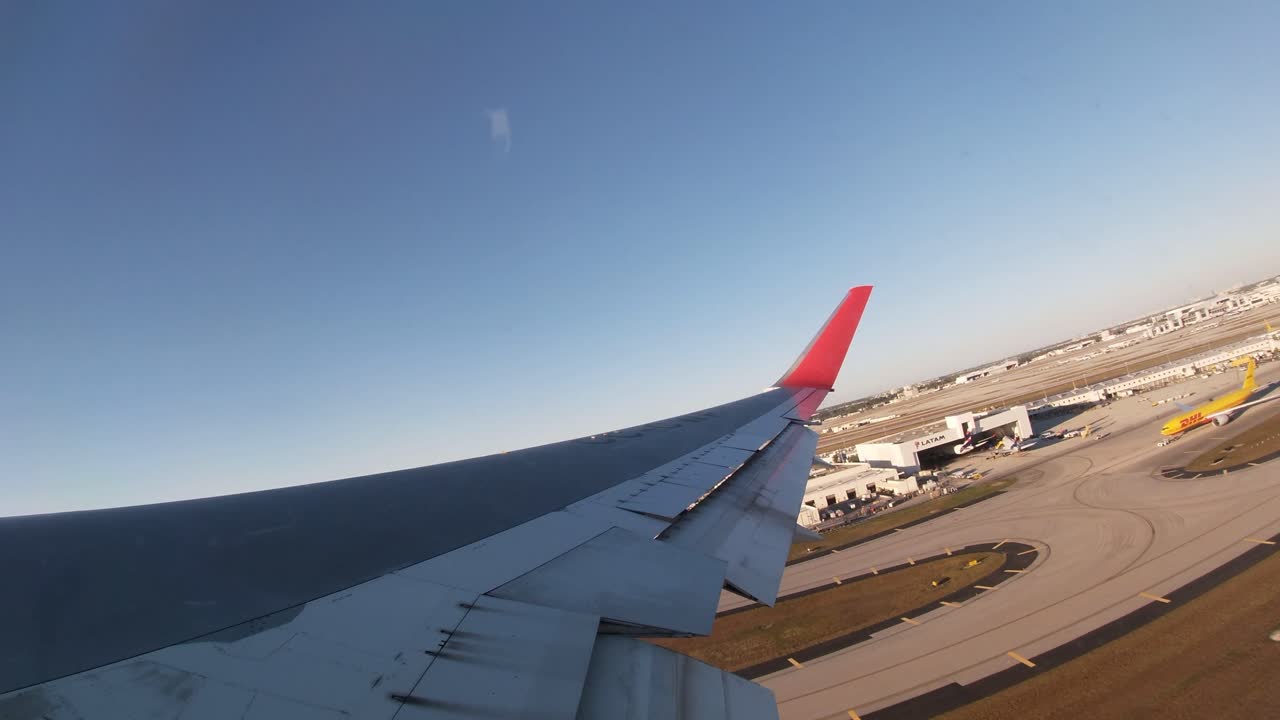Passenger View of Airplane Taking Off from Airport Runway